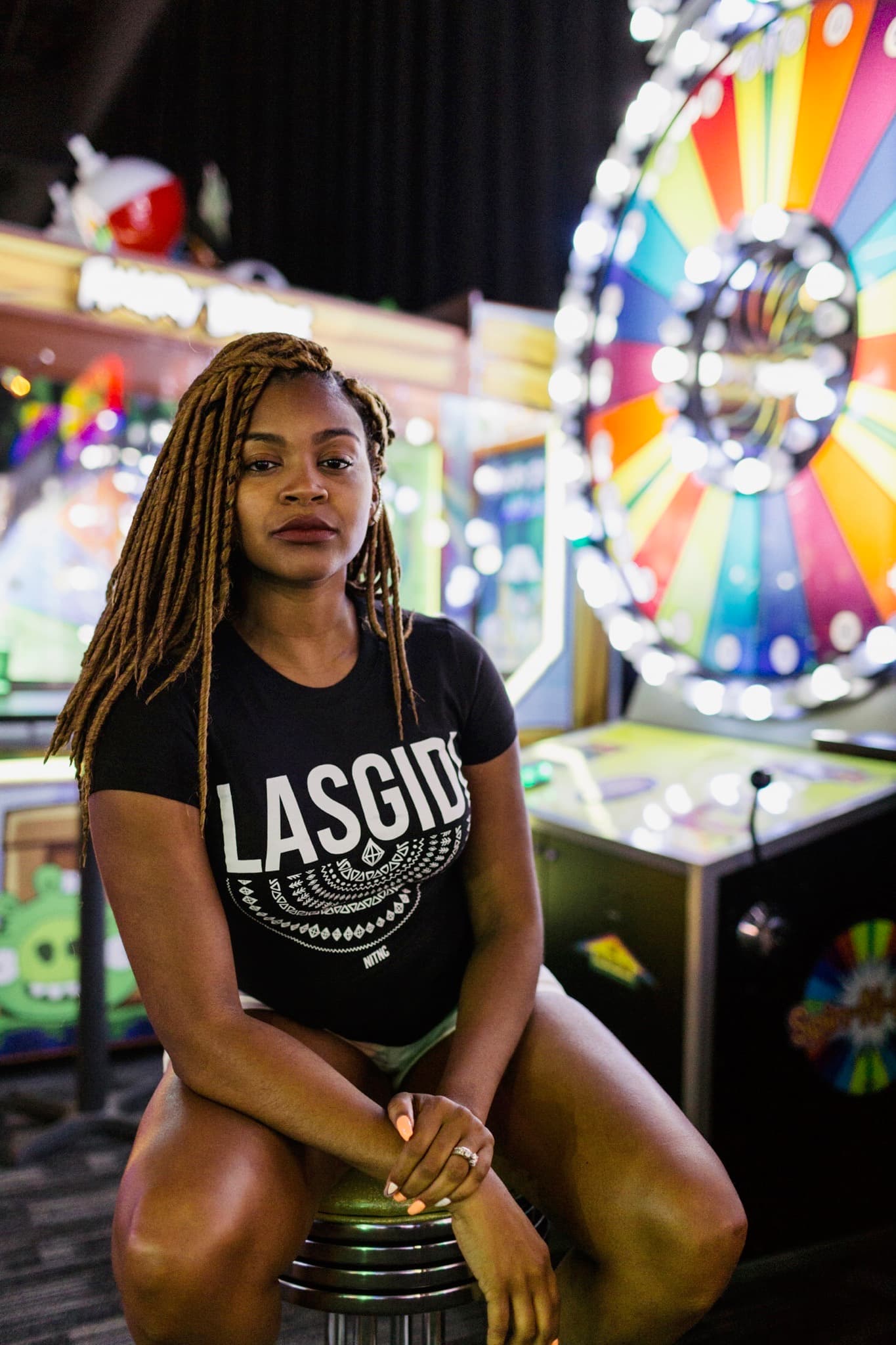 NITNC Lasgidi campaign portrait inside a colorful arcade