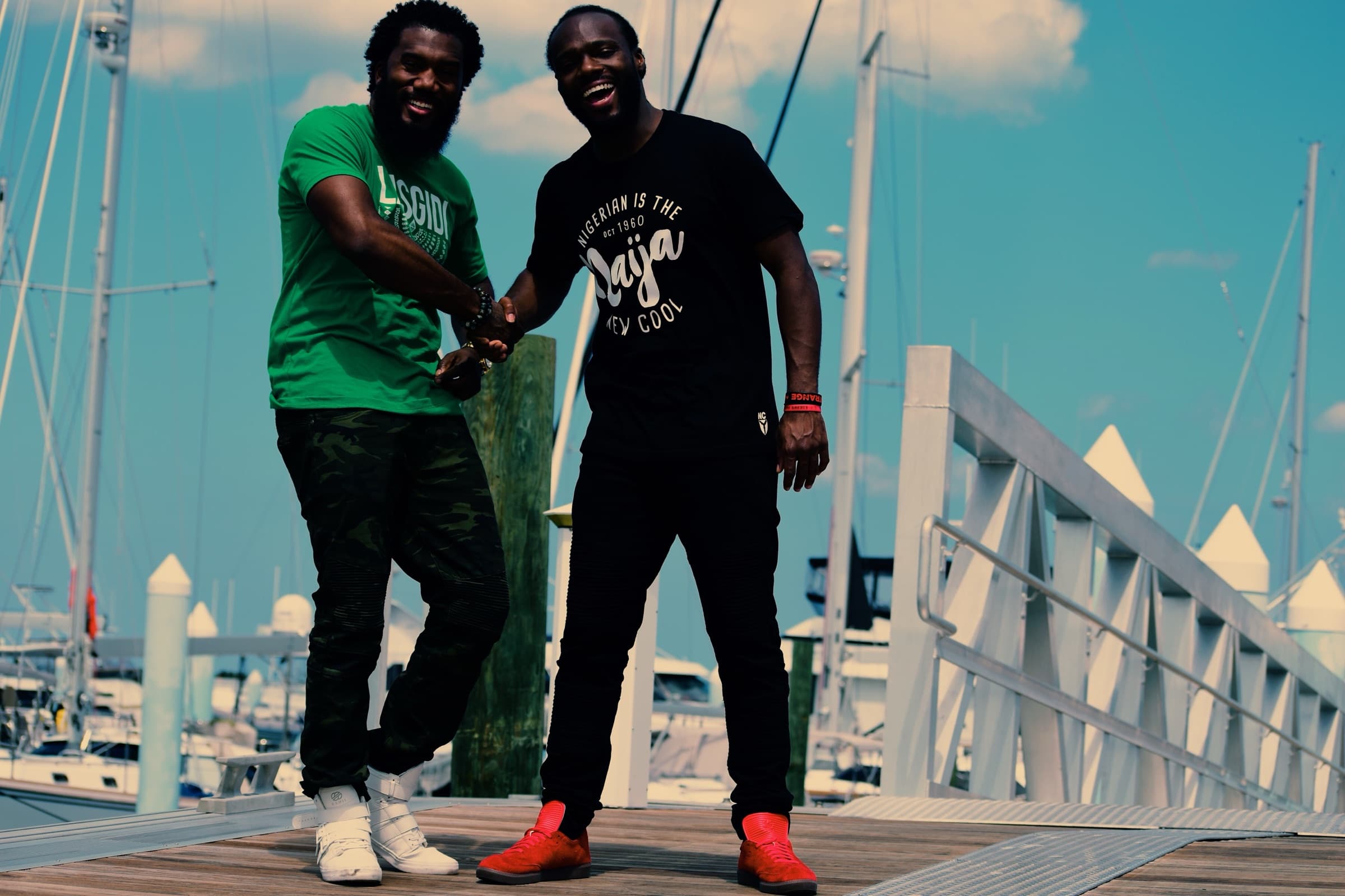 Two NITNC community members greeting each other at a marina