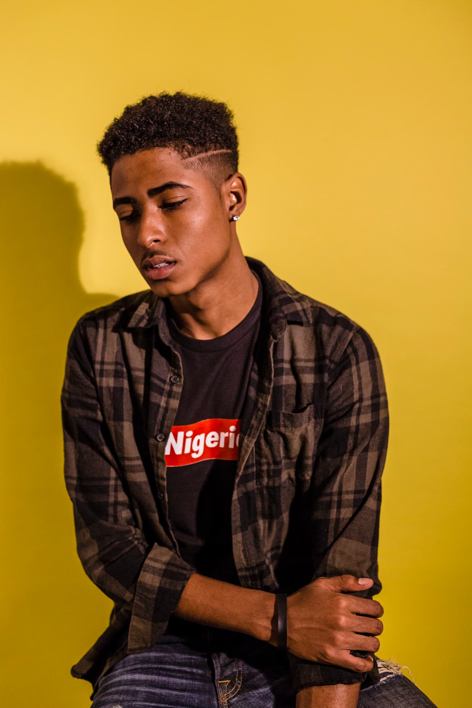 NITNC campaign portrait against a vivid yellow studio backdrop